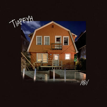The album cover for Left At London's T.I.A.P.F.Y.H. It shows an orange, barn style house with a cement porch.